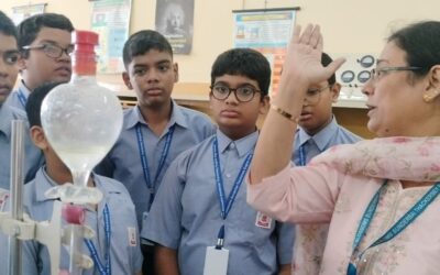 Students of std 8A observing the separating technique of separating immiscible liquids using a separating funnel. The teacher also demonstrated the use of a centrifuge machine to separate particles suspended in a liquid.The students were also given an opportunity to handle the apparatus